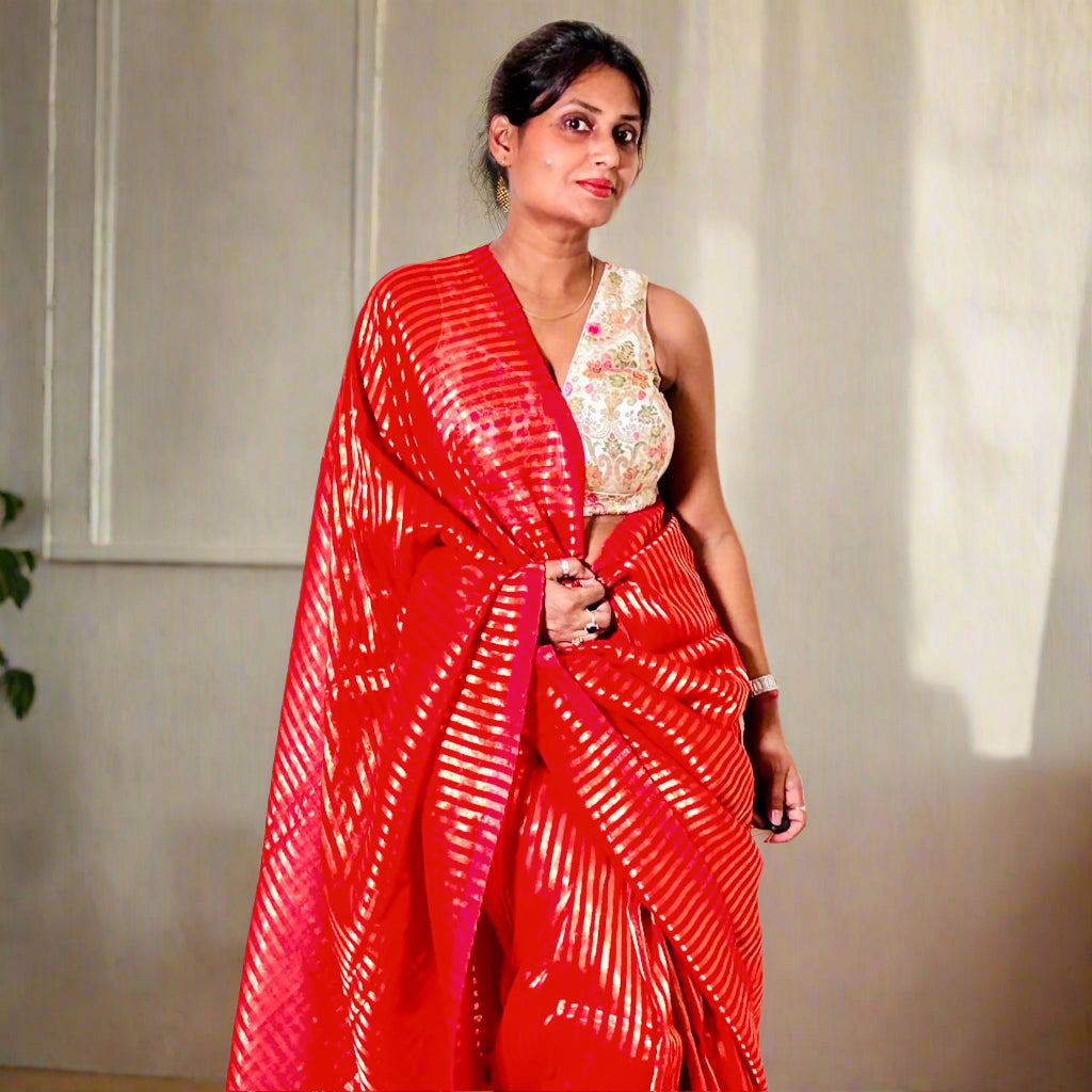 Mulmul Handwoven zari Saree with Vertical gold Stripes and Tassles