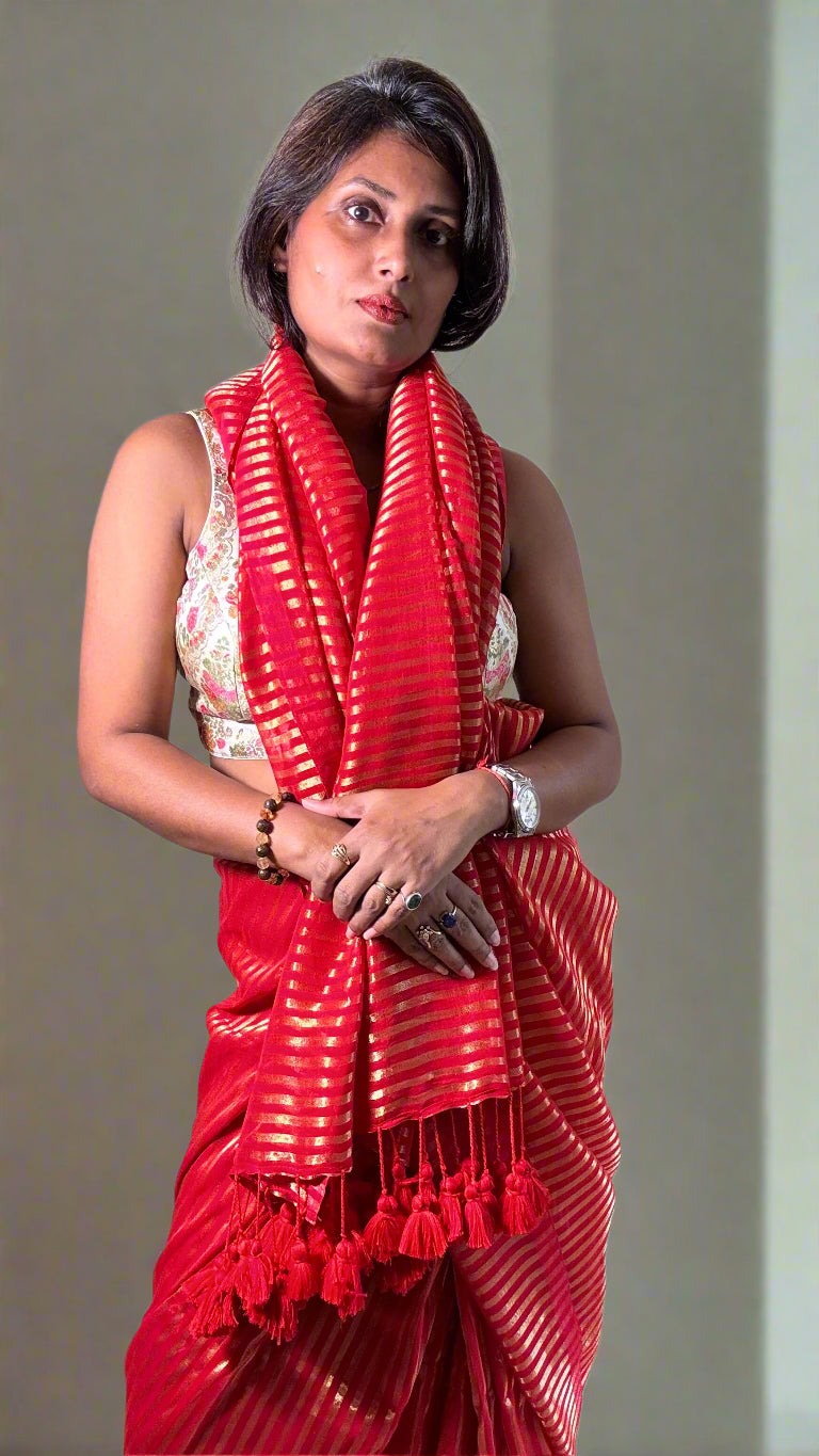 Mulmul Handwoven zari Saree with Vertical gold Stripes and Tassles