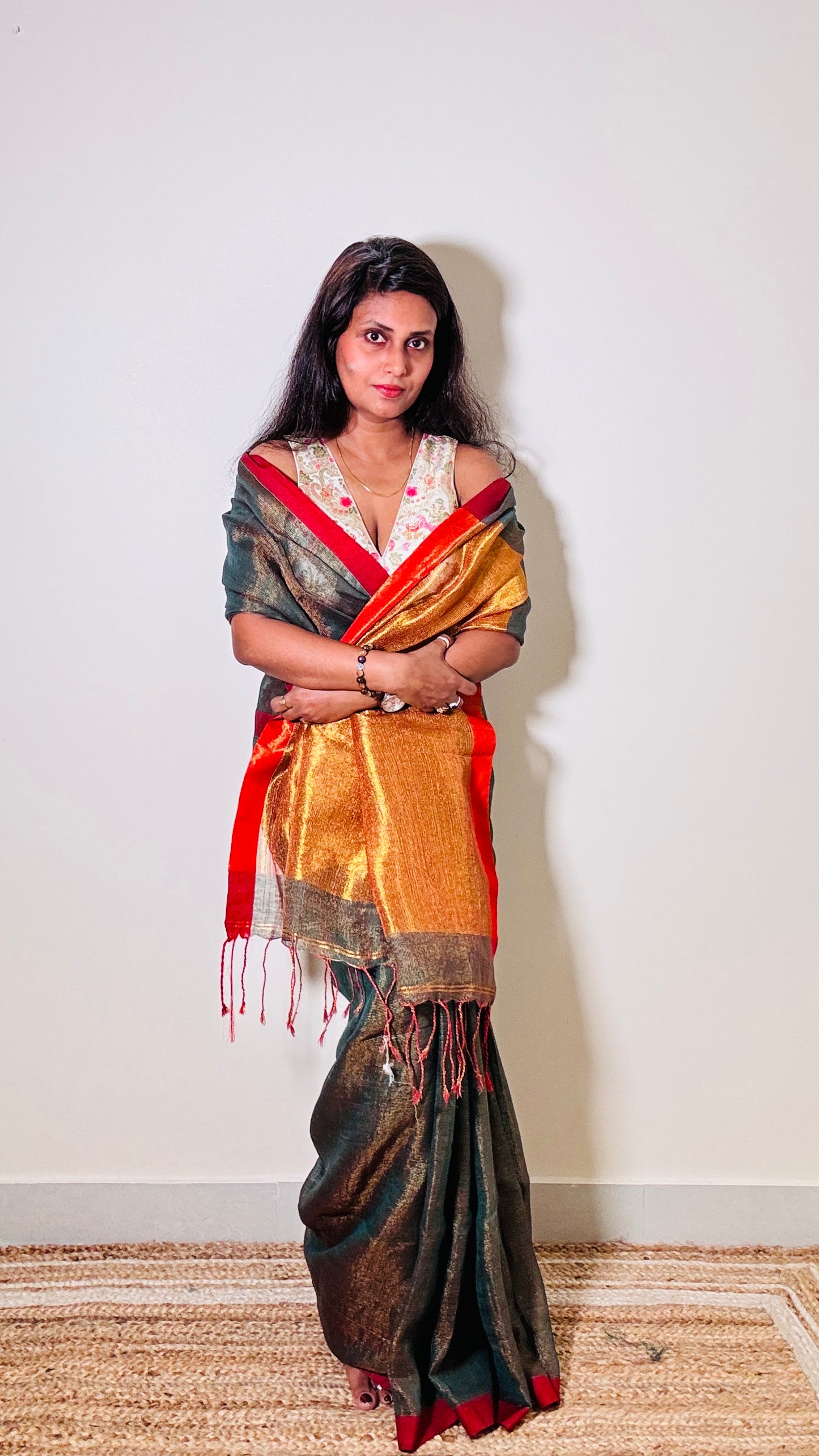 Teal Green tissue linen saree with golden zari pallu
