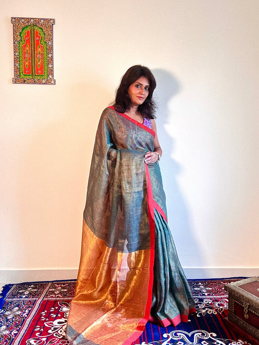Teal Green tissue linen saree with golden zari pallu